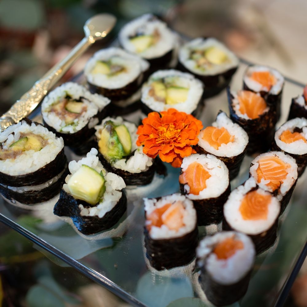 Sushi rolls and edible floral detail from the Fabrieks food experience